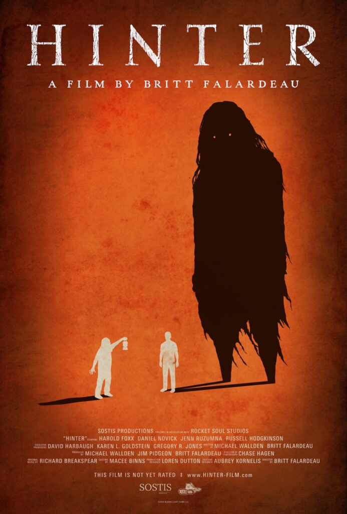 Hinter poster: two silhouetted figures, with a shadow stemming from one that produces a towering, witch-like figure with glowing eyes, with a rust-orange background